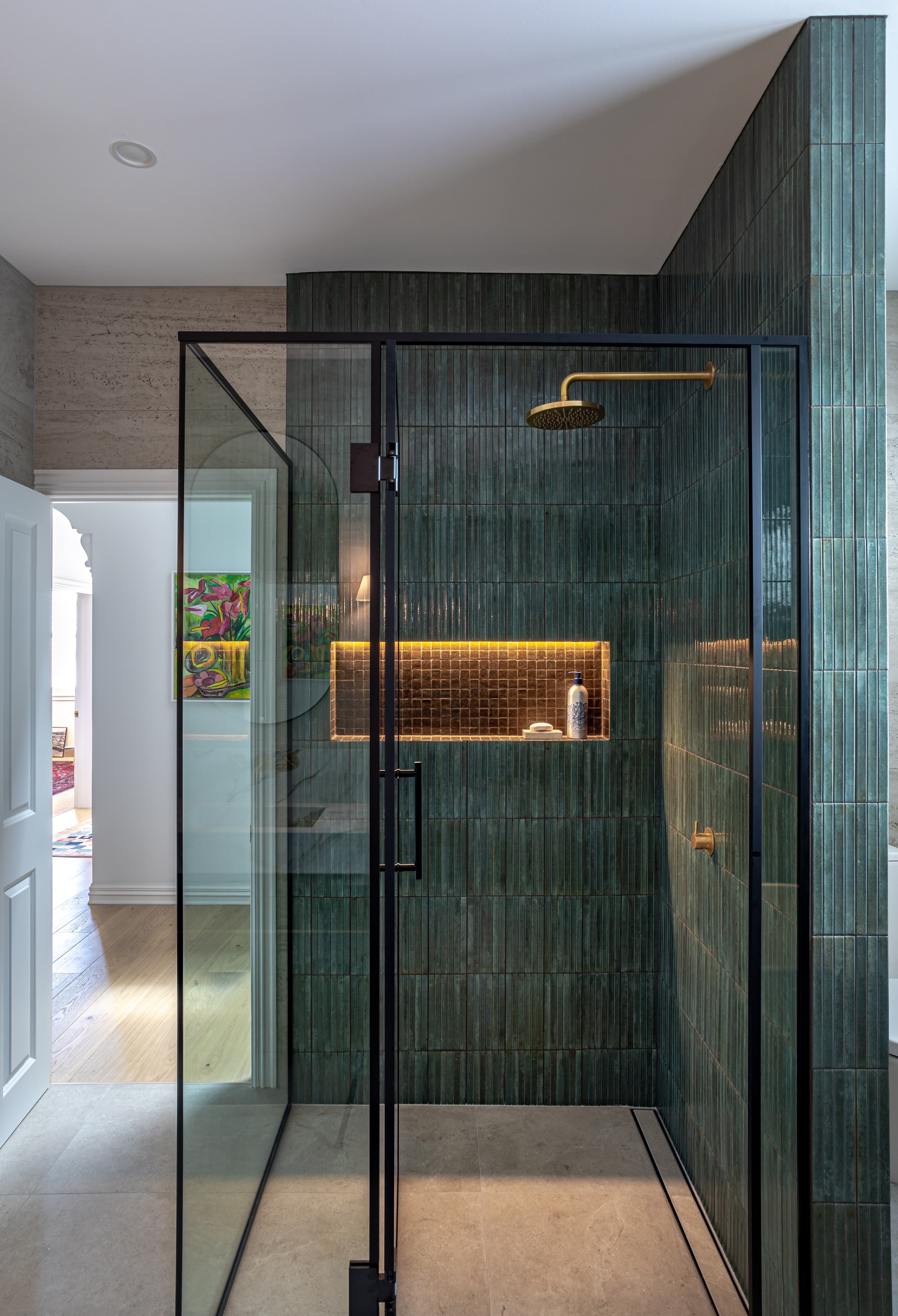 Walk-in shower with frameless glass enclosure