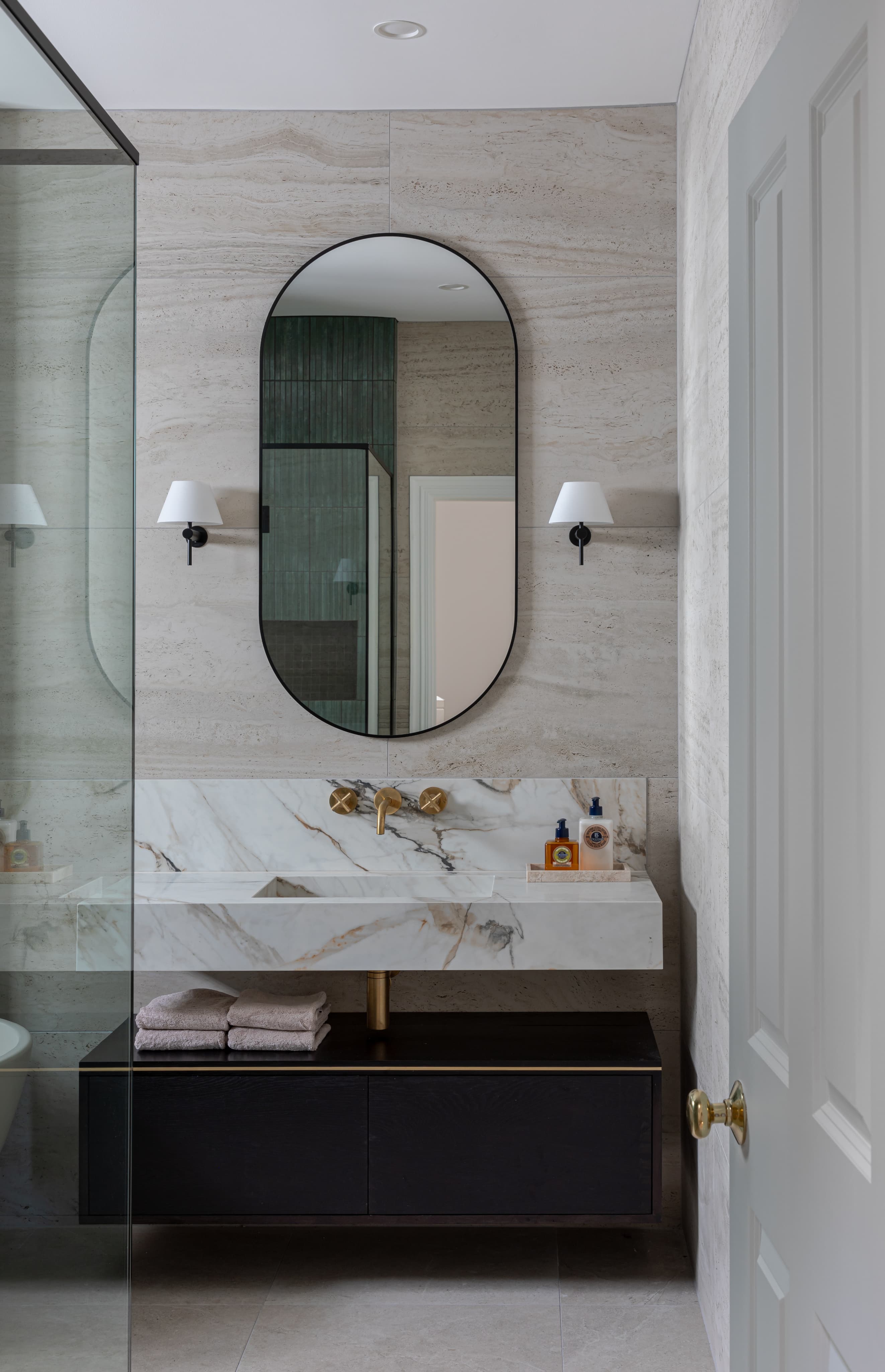 Floating cabinetry with natural stone bench top