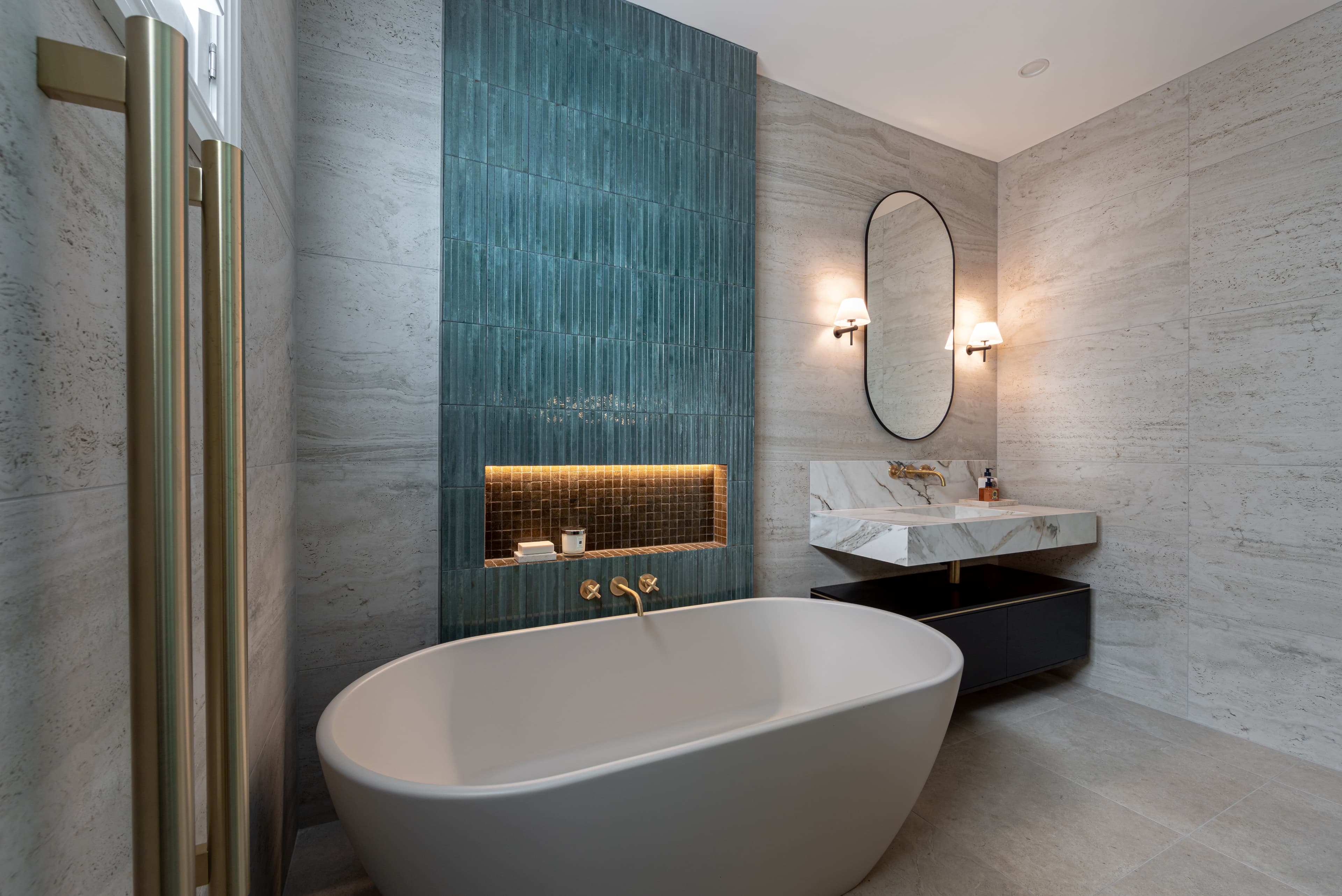 Natural stone bathroom with feature tiling