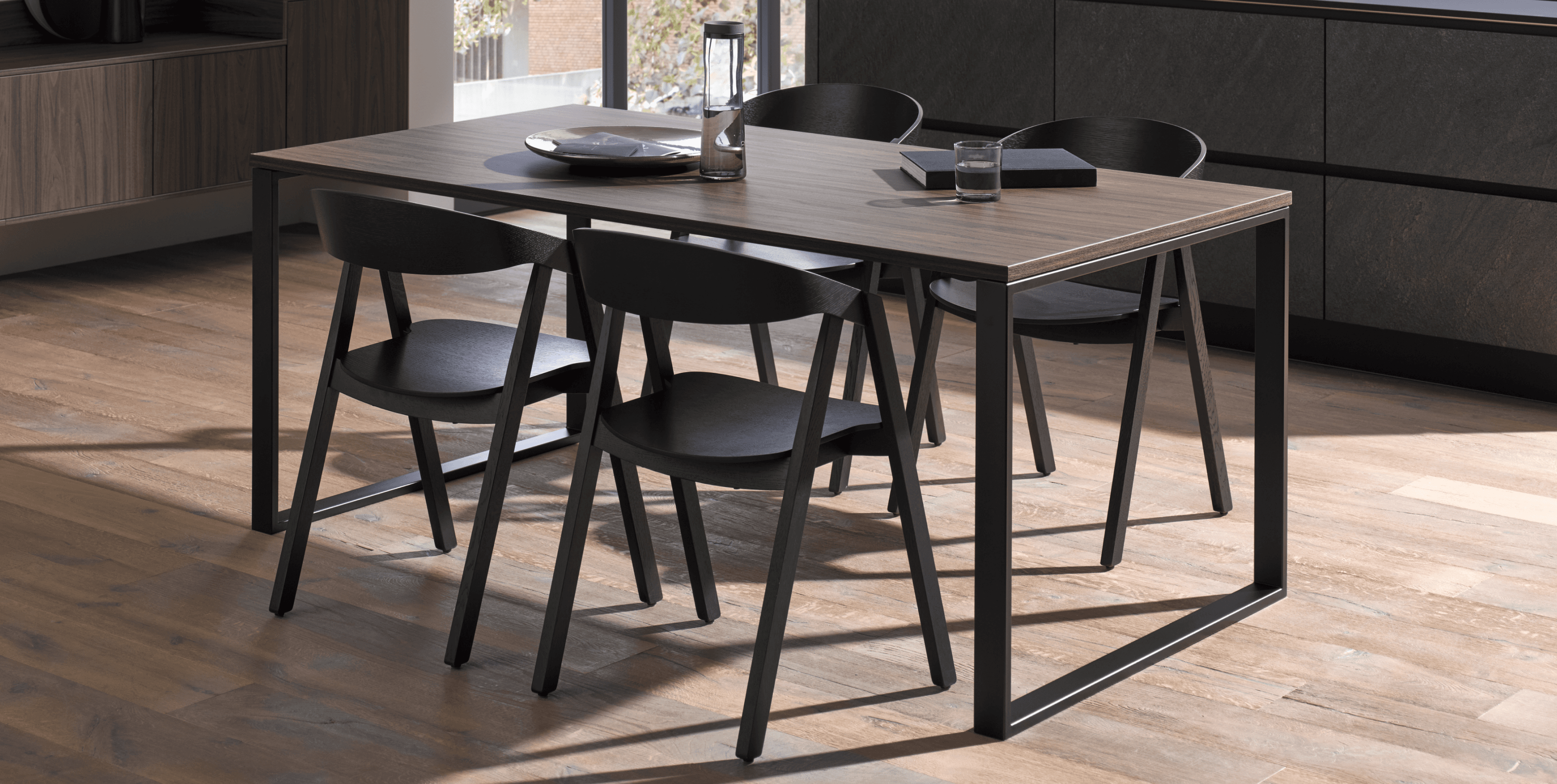 Blend kitchen, dining, and lounge spaces with a minimal palette that keeps focus on architectural lines and natural light.