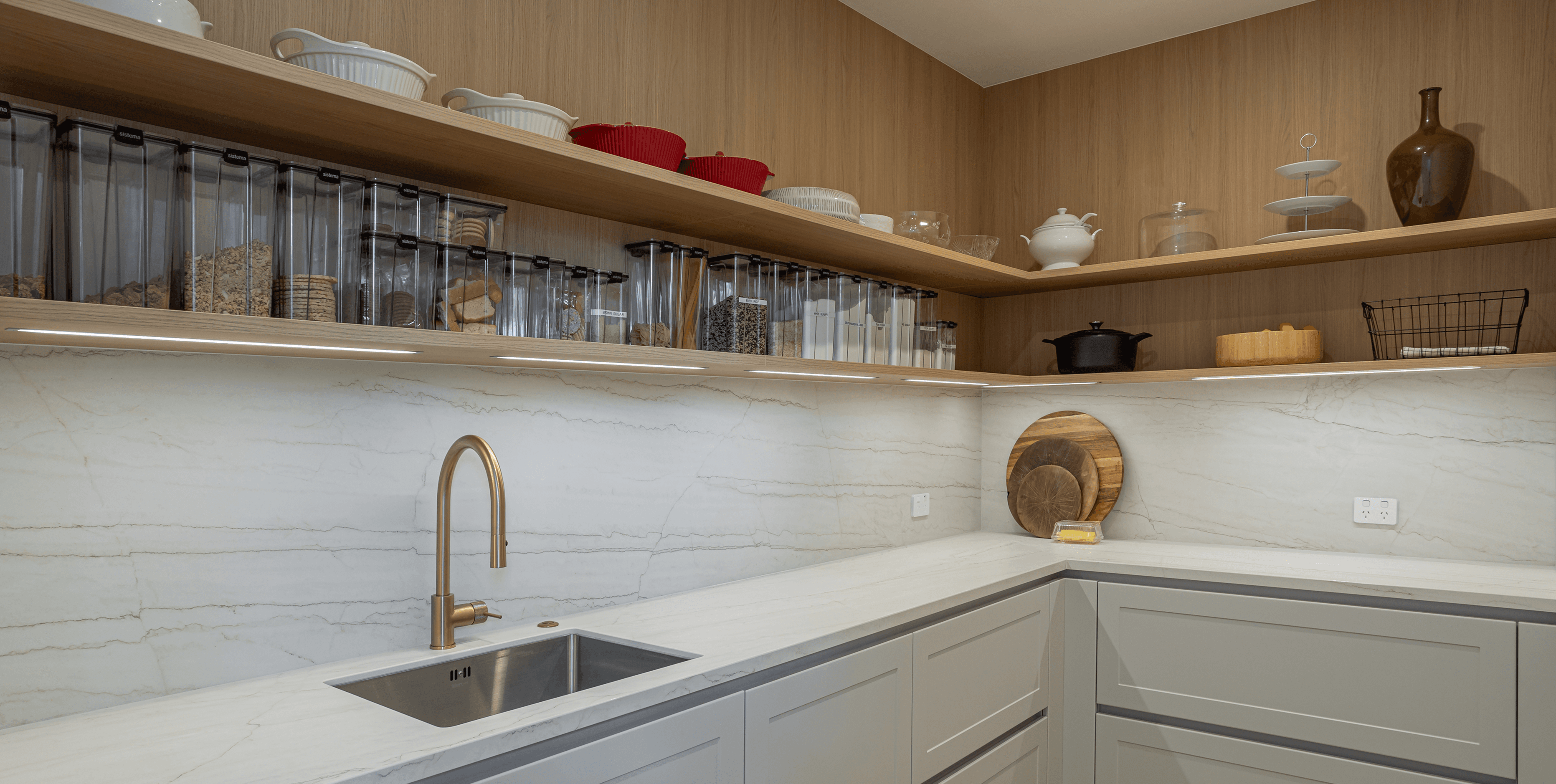 Elegant, functional storage with open shelving and subtle illumination.