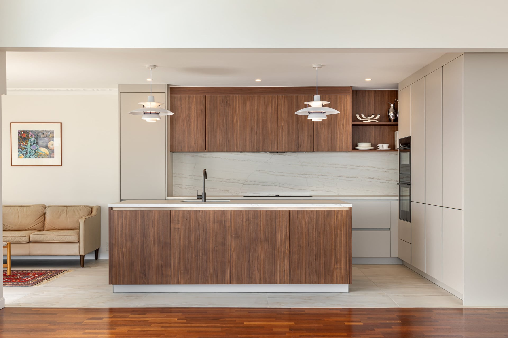 Seen from the lounge, the timber-look island sits in the room like a piece of furniture.