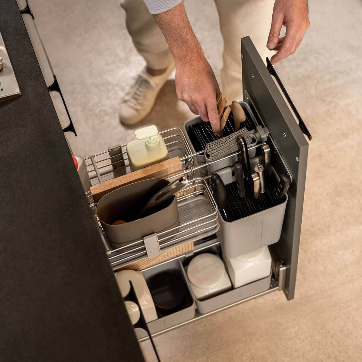 CookingAGENT pull-out mini pantry beside the cooktop