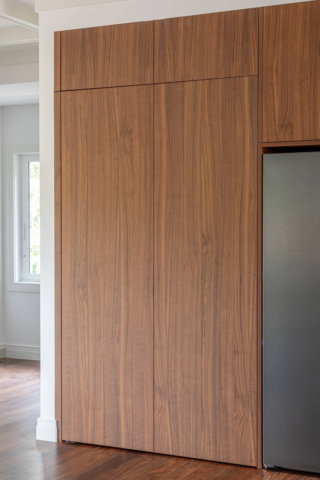 Pocket slider doors gliding open into concealed pockets