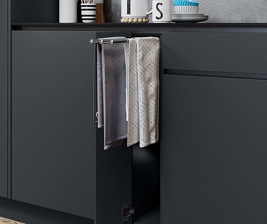Pull-out towel rail extended from the cabinetry