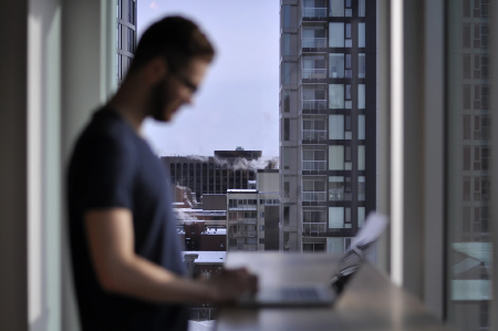 Man scrolling laptop 