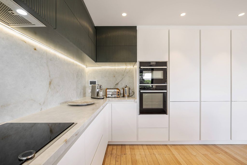 Newly built kitchen highlighting large stone features as a kitchen design trend in 2023